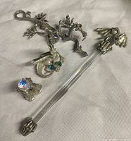 Group shot showing both dragon figurines, wand, crystal ball in stand