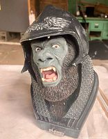 Front view of Attar bust showing facial detail and helmet