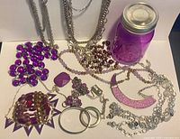 Entire collection of jewelry and jar laid out