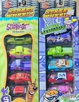 Front view of both sealed 5-pack sets showing Scooby-Doo and Dexter’s Laboratory themes