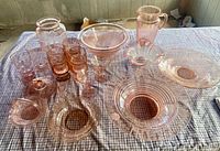 Full group view of all 19 pink glass pieces