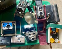 Overview of all cameras and accessories on table