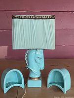 Lamp with shade and two crescent dishes front view