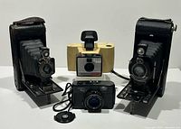 Group shot of all four cameras positioned together