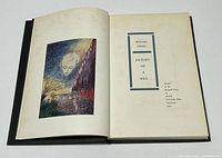 Open book showing colour frontispiece and title page