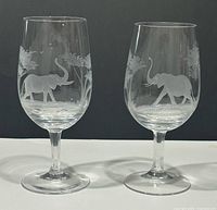Front view of both etched elephant wine glasses