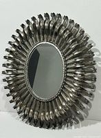 Front view showing full mirror and sunburst frame