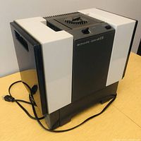 Front and side view of the Bionaire humidifier showing overall condition and power cord