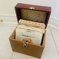 Carrying case open showing index cards and records inside