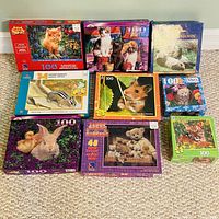 Overall view of all eight puzzle boxes laid out on the floor