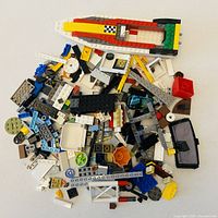 Spread of assorted Lego pieces on table