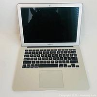 Front view of open 2017 MacBook Air with screen and keyboard visible