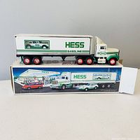 Box and 18-wheeler truck with racer shown on artwork