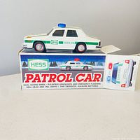 box front with patrol car illustration and toy car partially visible