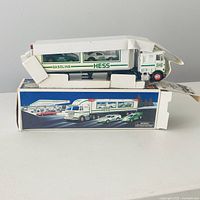 Truck displayed atop original box, partial inserts visible