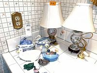 Overview showing lamps and multiple ceramic animal pieces