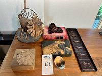 Group shot of all six lion décor items displayed on table