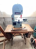 Full view of Delta band saw mounted on Singer treadle table