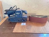 Mastercraft belt sander with sanding belt on table