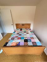 Top view of bed with quilt and headboard