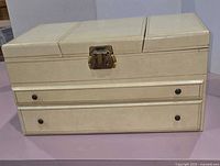 closed cream vinyl jewelry box front view