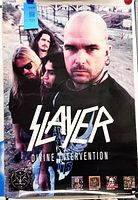 Full view of Slayer Divine Intervention poster showing band photo and graphics