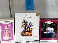 Front view of three Hallmark Keepsake ornament boxes