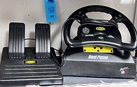 Mad Catz Dual Force racing wheel with pedals for PlayStation | Maxsold