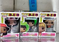 Front view of three boxed Funko Pop TLC figures