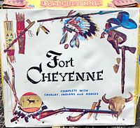 Box side panel showing Fort Cheyenne title and decorative weapon graphics