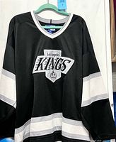 Front view of Los Angeles Kings black and white Starter jersey