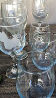 Assorted stemmed and stemless clear wine glasses on table