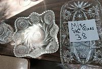 Group showing square bowl, rectangular tray, partial round candy dish