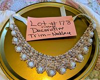 Front view of rhinestone and faux pearl necklace