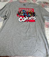 Full view of gray Marvel Comics T-shirt laid flat