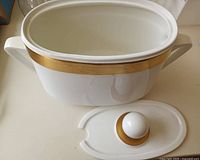 Tureen angled view with lid off showing gold rim and interior