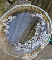 Top view of Mikasa glass platter showing entire poinsettia design