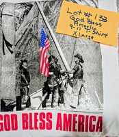 Close-up of front graphic showing firefighters, flag, and text