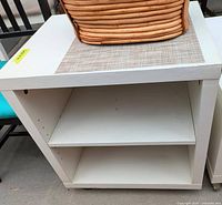 Front view showing open shelving and adjustable shelf