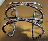 Open design cuff bracelet with overlapping bands