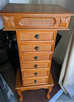 Full view of wooden jewelry armoire chest on cabriole legs