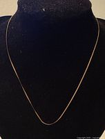 Necklace displayed on bust showing full length