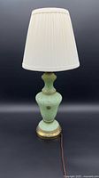 Full view of marbled green glass lamp with shade