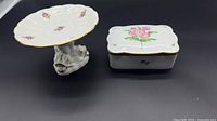 Cake stand and lidded box side by side
