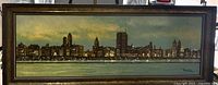 Full view of framed panoramic cityscape oil painting
