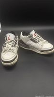 Full pair of Nike Air Jordan 3 sneakers side by side