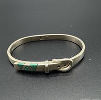 Full view of hinged buckle bangle showing malachite inlay and clasp