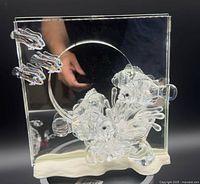 Front view showing mirror, three clownfish, anemone and base