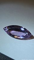 Marquise-cut amethyst side view showing facets and color