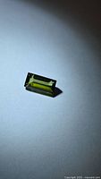 Front view of rectangular baguette-cut green tourmaline